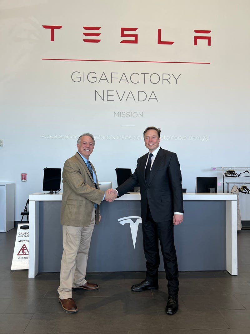 Nevada Governor Joe Lombardo and tesla founder Elon Musk shake handes