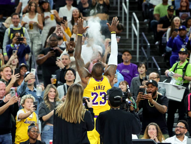 LeBron James #23 of the Los Angeles Lakers tosses chalk in the air before a preseason game against the Golden State Warriors at T-Mobile Arena at T-Mobile Arena on October 15, 2024 in Las Vegas, Nevada.