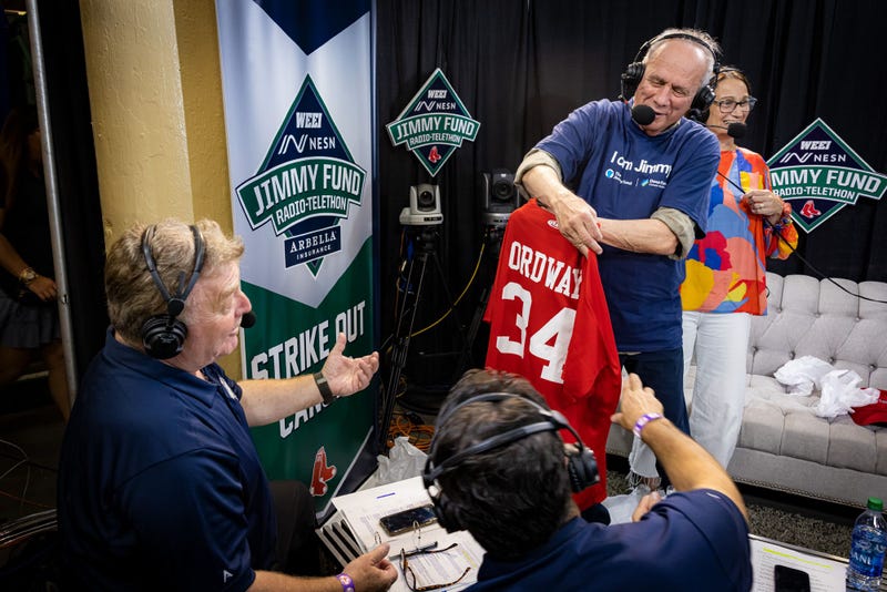 Lisa Scherber and Larry Lucchino with a special gift for Ordway