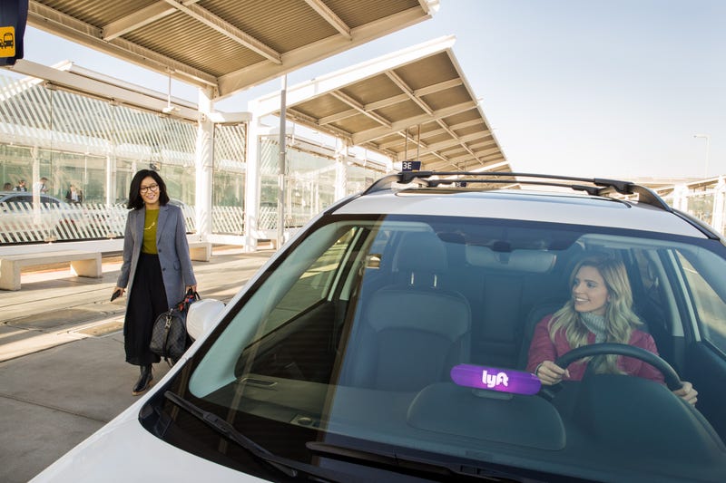 Lyft driver pickup up a passenger.