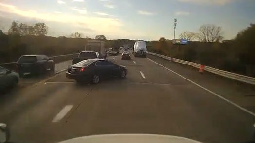 WATCH: Car pushed into path of semi in wild six-vehicle freeway crash near Ann Arbor