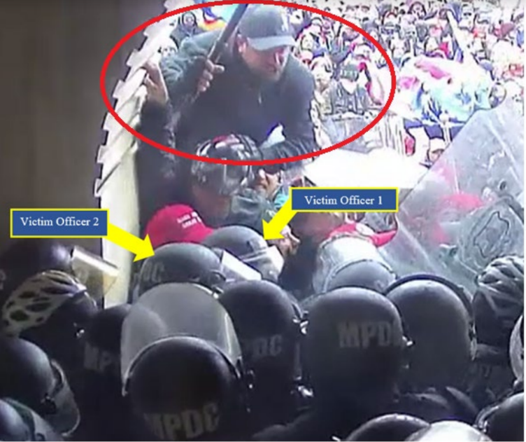 Federal prosecutors say Richard Markey, 38, of Wolcott (circled) climbed on fellow rioters to attack police at the U.S. Capitol on Jan. 6, 2021