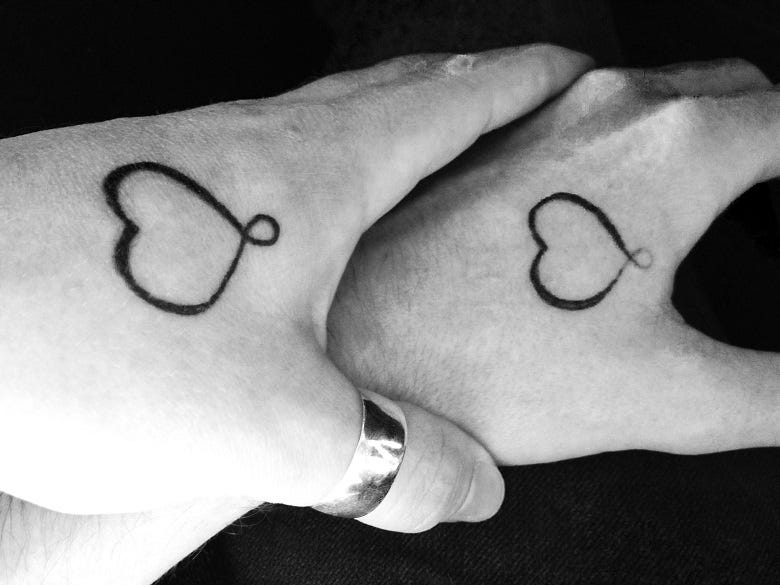 couple with matching tattoos