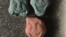 "Parents beware!" Michigan State Police alert public about smiling face ecstasy tablets