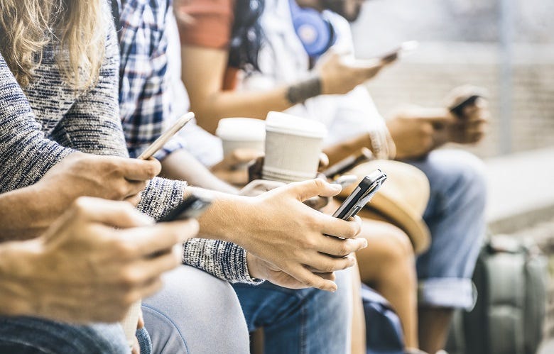 Millennials talking on phones & drinking coffee