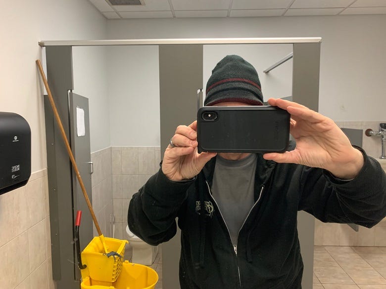 Rock taking photo in mirror