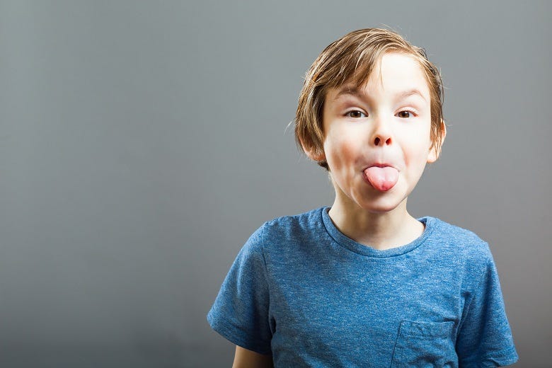kid sticking tongue out