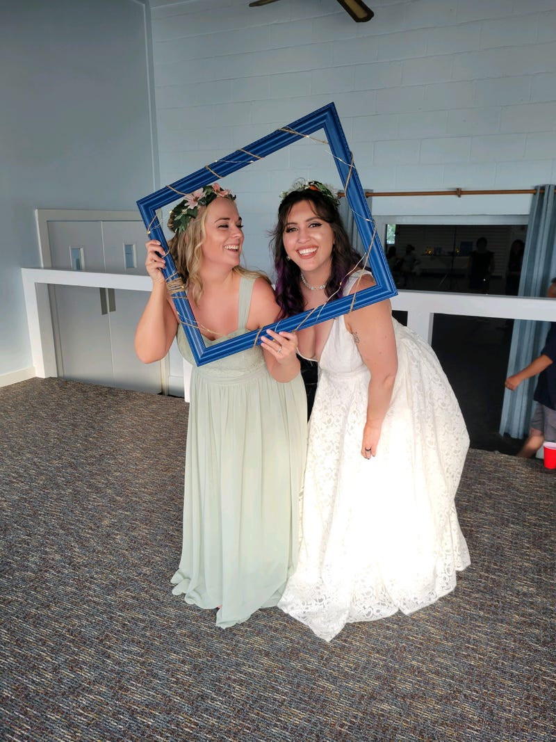 Lauren and Alanna taking a fun photo at the reception