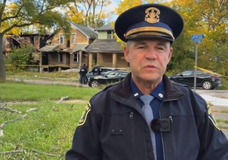 First Lt. Mike Shaw in front of abandoned home