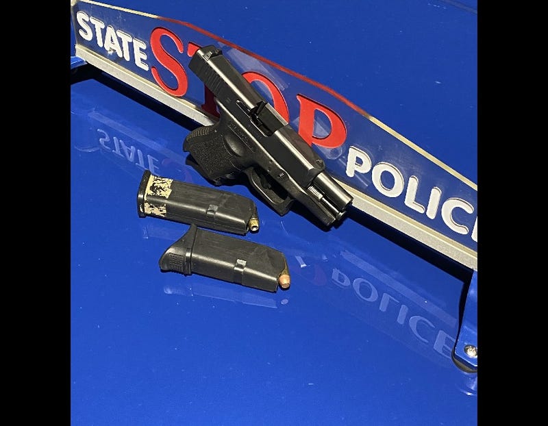 Illegal gun and magazines on Michigan State Police patrol car