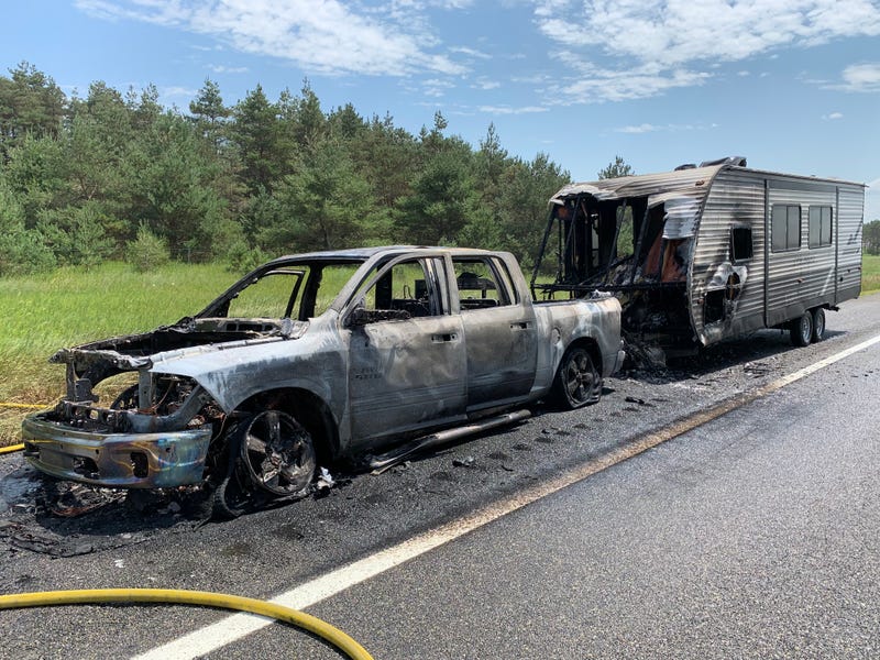 Truck and camper burned along I-75