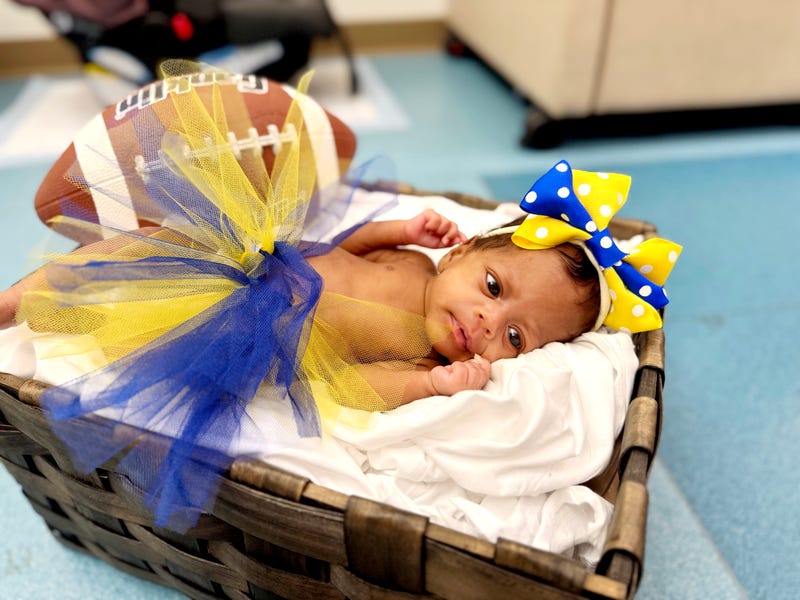U of M baby in basket