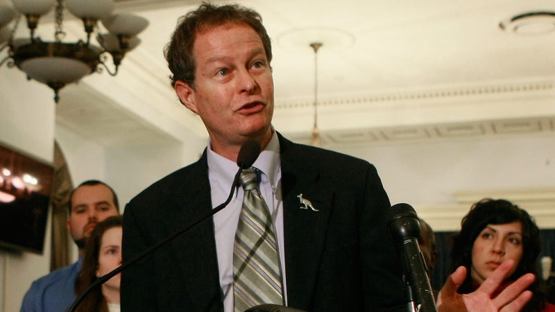 John Mackey, CEO of Whole Foods, speaks while surrounded by Whole Foods employees during a news conference on Capitol Hill, December 9, 2008 in Washington, DC. 