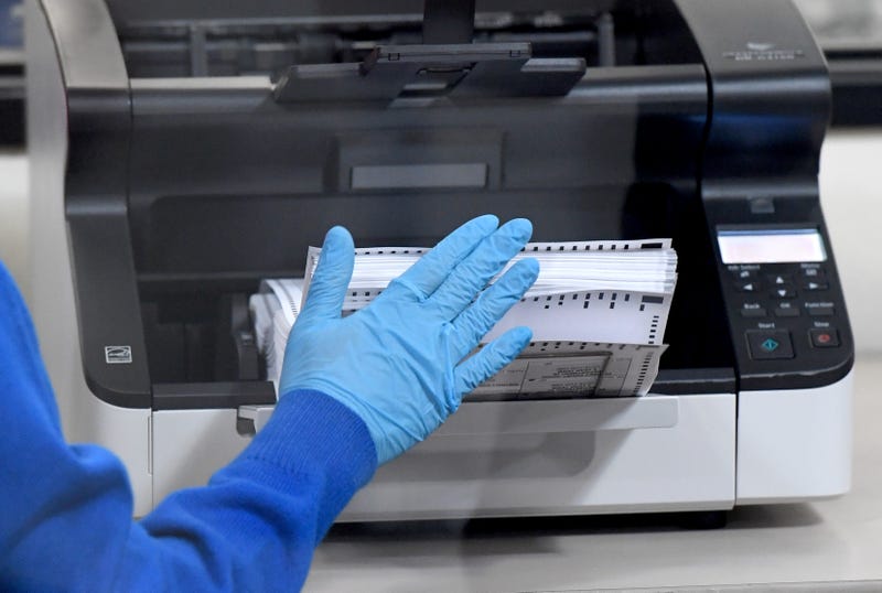 A Clark County election worker scans mail-in ballots at the Clark County Election Department on October 20, 2020 in North Las Vegas