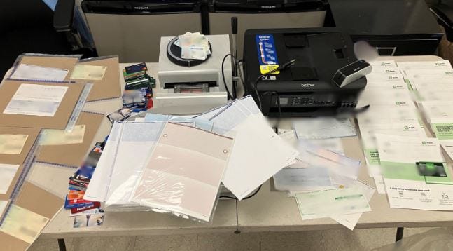 Jamil Brown, 32, was arrested and charged for a large-scale mail theft operation after a court-authorized search found dozens of stolen cards, checks and licenses in his home.