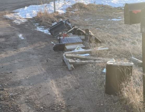 Row of damaged mailboxes