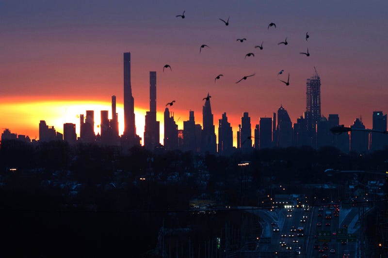 The sun rises over Manhattan, as seen from Route 3 in Clifton, New Jersey, on Jan. 18, 2024