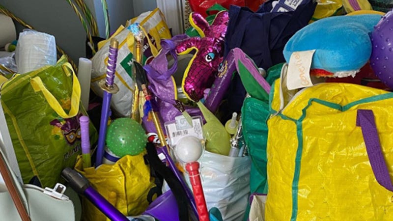 pile of toys and caught items from Mardi Gras parades