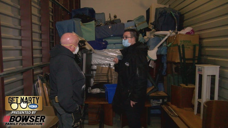 Kevin Seger and Marty Griffin inside storage unit