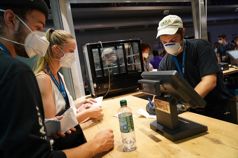 Diners wearing face coverings order at a Las Vegas restaurant