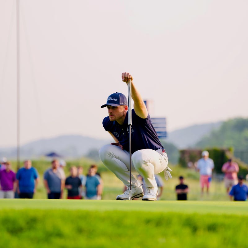 Matt Vogt looking at a putt at Oakmont