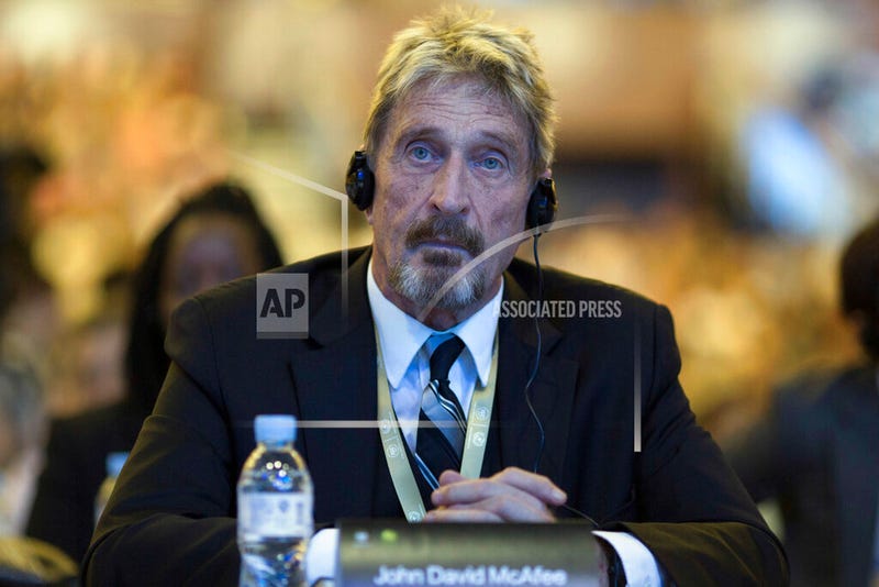 In this Tuesday, Aug. 16, 2016 file photo, founder of the first commercial anti-virus program that bore his name, John McAfee listens during the 4th China Internet Security Conference (ISC) in Beijing. Spain's National Court has approved the extradition of detained antivirus software entrepreneur John McAfee to the United States, where he is wanted on tax-related criminal charges that carry a prison sentence of up to 30 years. (AP Photo/Ng Han Guan, File)