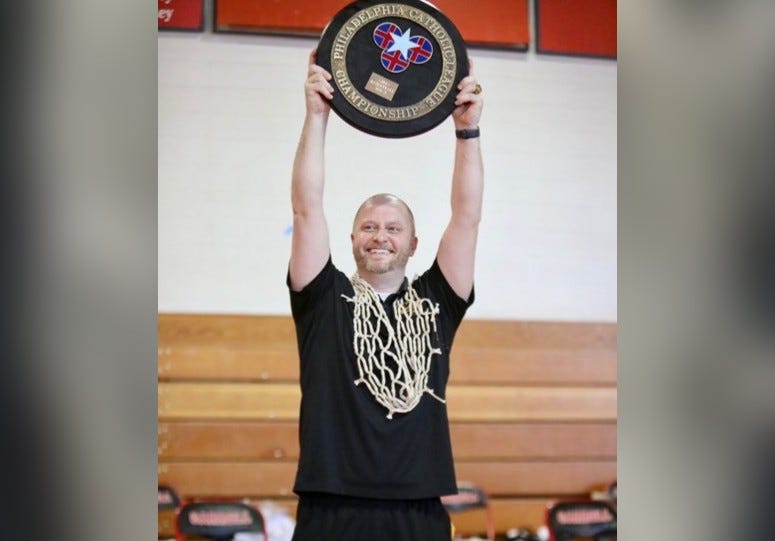 Mike McDonald holding a championship plaque.