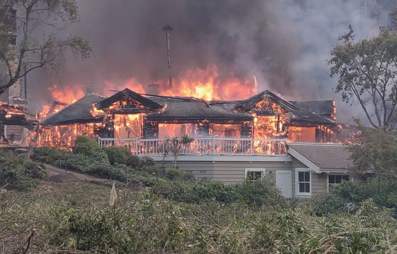 A portion of the five-star Meadowood resort burns.