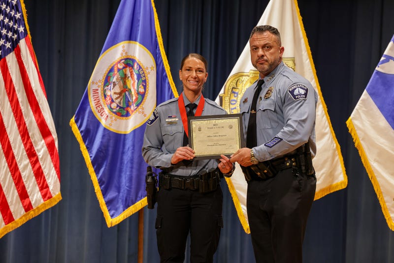 Officer Ashley Bergersen and Minneapolis Police Chief Brian O'Hara.