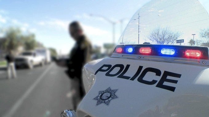 A Las Vegas Metro Police officer works an accident scene