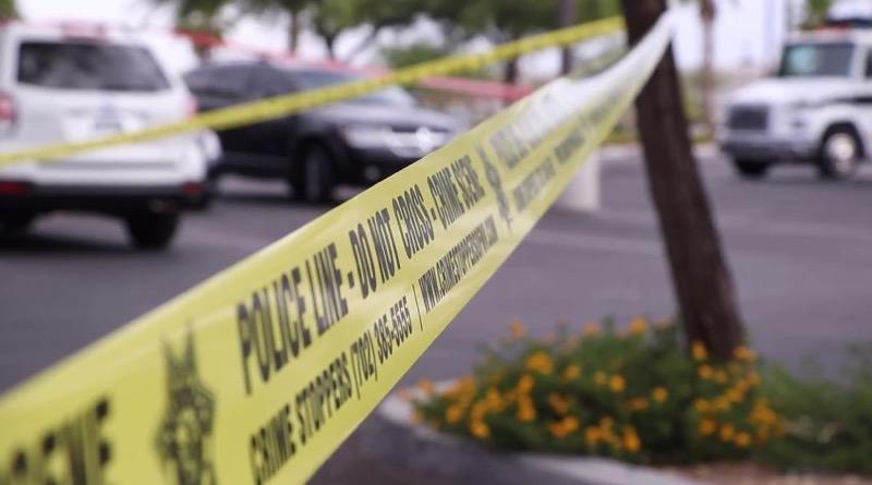Police tape ropes off a crime scene
