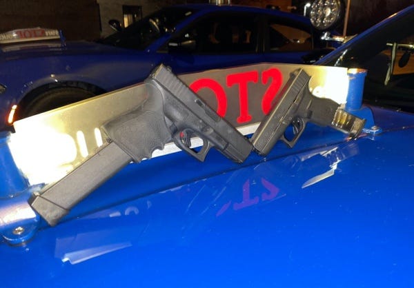 Two handguns and ammunition recovered by Michigan State Police during a traffic stop near Lansing