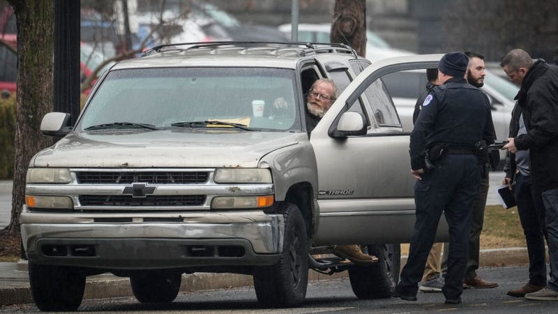 Parked in front of the Supreme Court illegally, Dale Paul Melvin talks with U.S. Capitol Police officers February 3, 2022 in Washington, DC. 