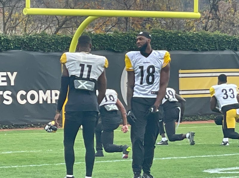 Mike Williams talking with Van Jefferson at practice