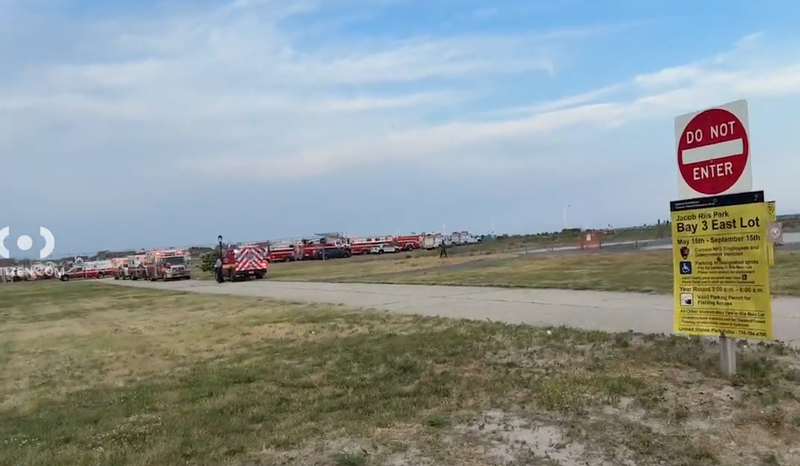 Officials respond to help in the search for two missing teen swimmers at Jacob Riis Park in Queens on Friday.