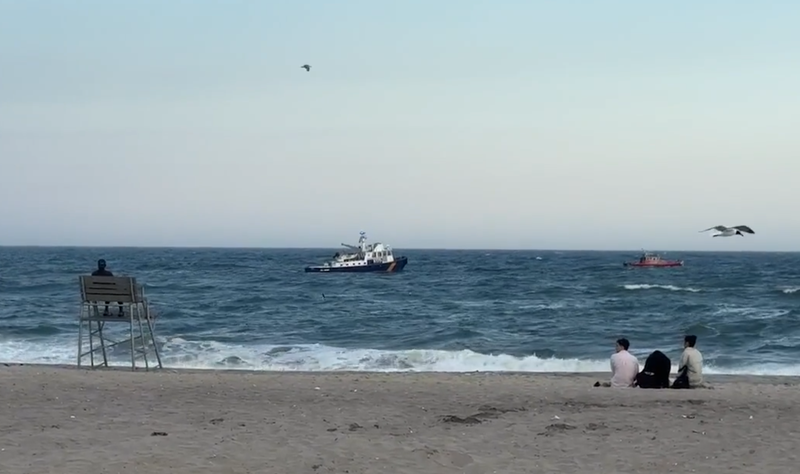 Official sea vessels searching for two missing teen swimmers at Jacob Riis Park in Queens on Friday.