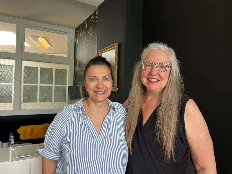 Monika Demel and Rhonda Caudill pose for a photo at Demel's photo studio in Portage Park. 