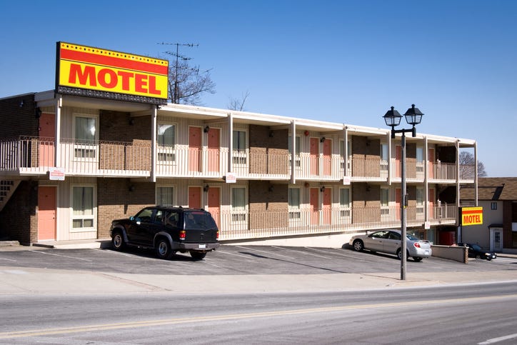 Motel with yellow sign