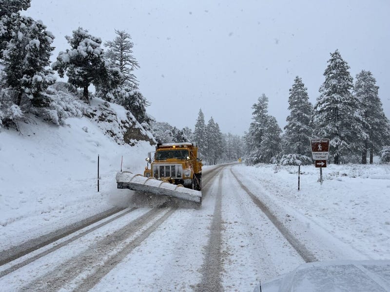 A plow removes snow from roads in the Spring Mountains