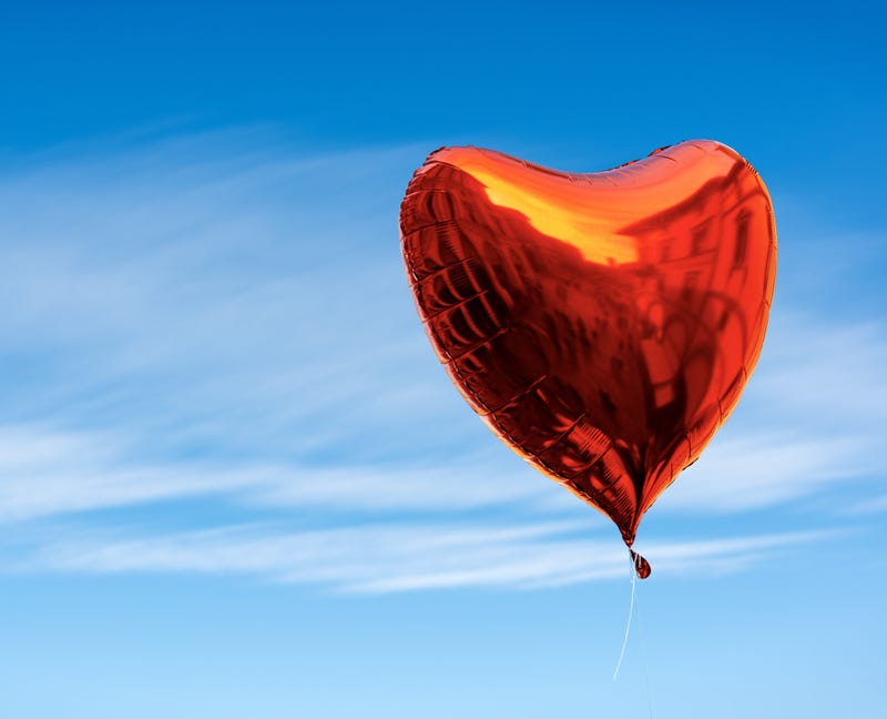 Mylar or foil Valentine's balloon in the sky