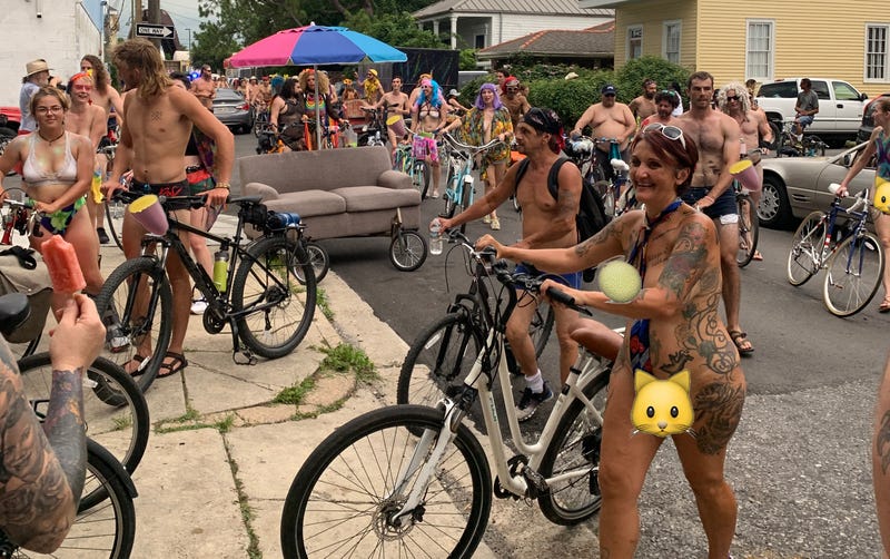 Naked Bike Riders gather at the playground after riding the city streets.