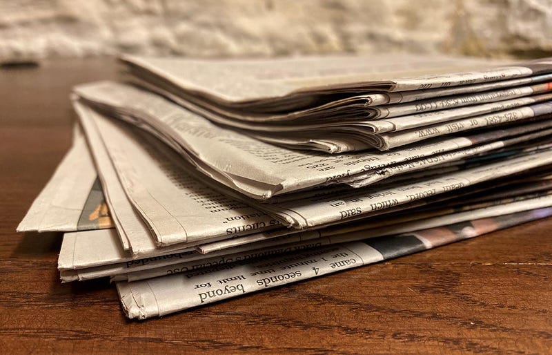 A stack of newspapers is pictured at the Illinois State Capitol.