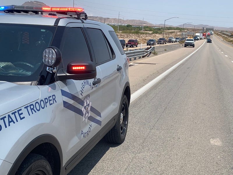 A Nevada State Police cruiser works the scene of an accident
