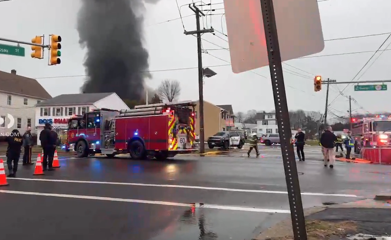 Emergency responders assist at the scene of a mattress fire in New Brunswick on Wednesday.