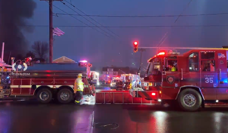 Emergency responders assist at the scene of a mattress fire in New Brunswick on Wednesday.