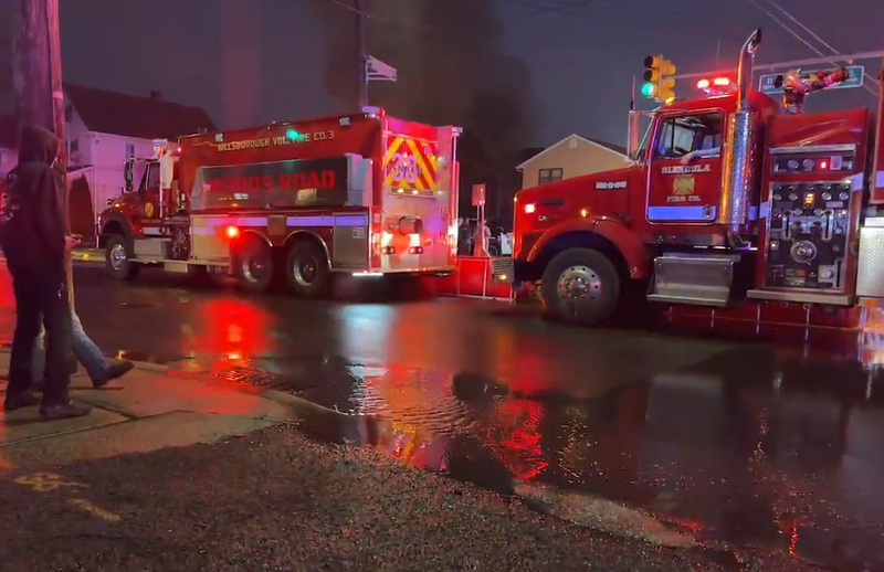 Emergency responders assist at the scene of a mattress fire in New Brunswick on Wednesday.