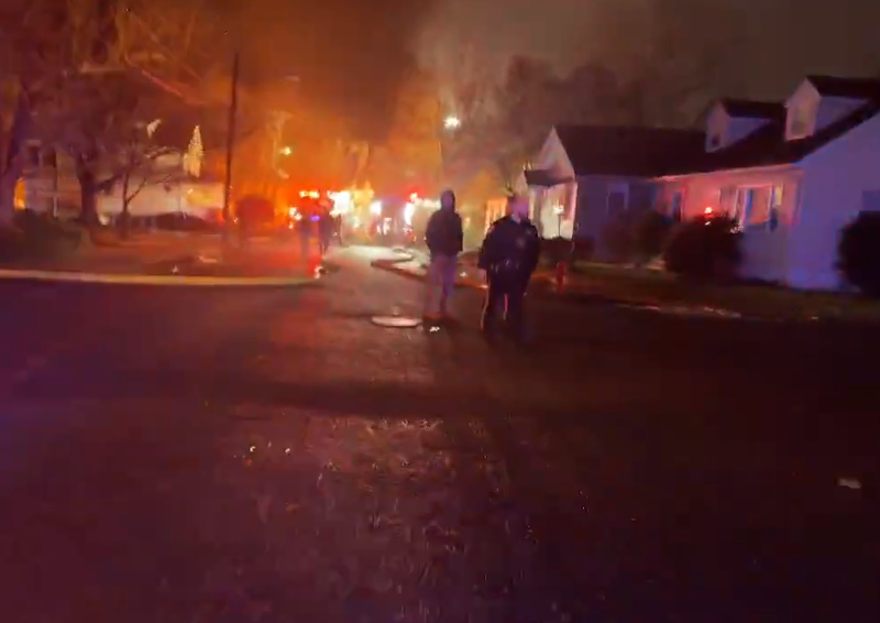 Emergency responders assist at the scene of a mattress fire in New Brunswick on Wednesday.