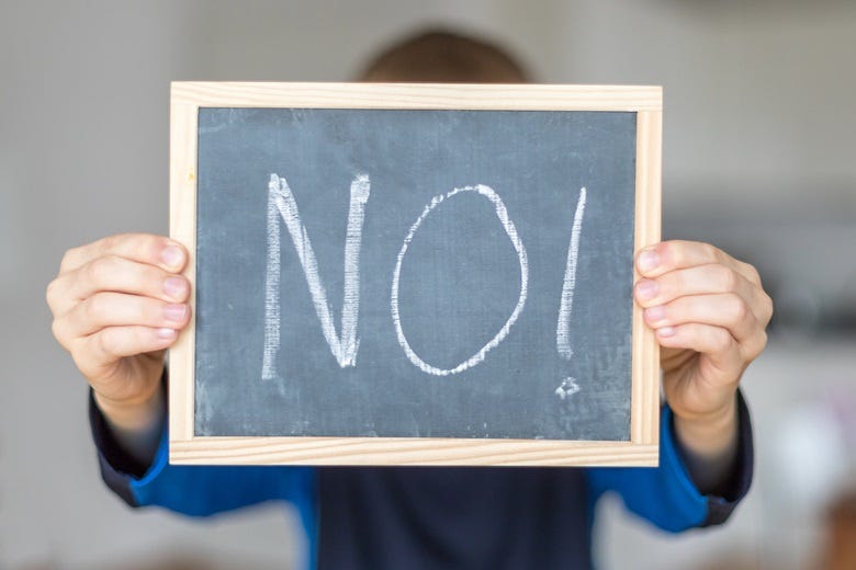 "No" written on chalkboard 