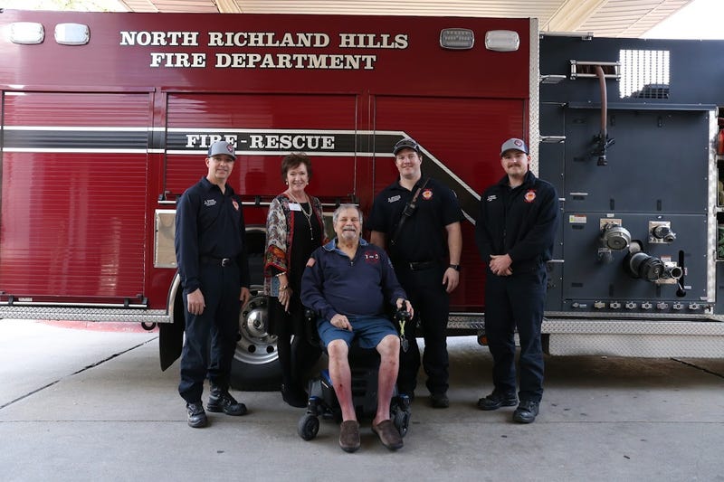 Retired firefighter Ed Grube, 77, gets a wish granted by the North Richland Hills Fire Department.