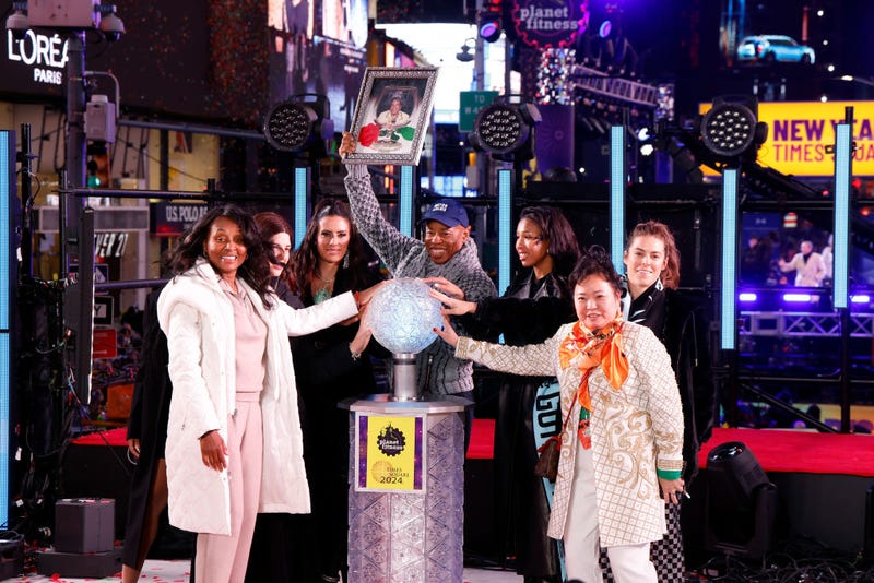 Tracey Collins, Eric Adams, and members of Gotham FC wait for the ball to drop during New Year's Eve in Times Square on Dec. 31, 2023.